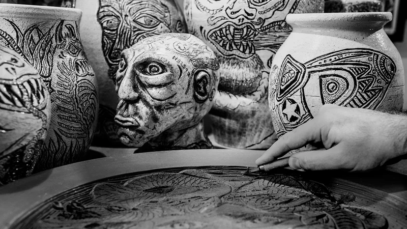 Fernando Feijoo working in his studio, hands crafting ceramic artwork